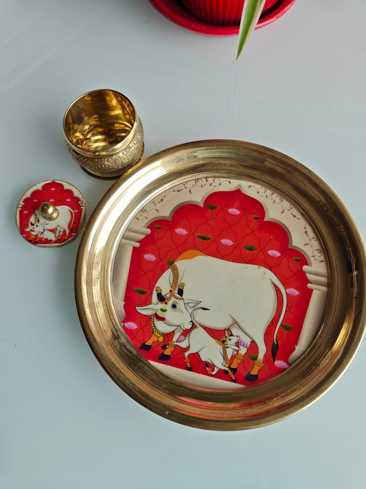 Decorative tray with a cow illustration on a light blue background