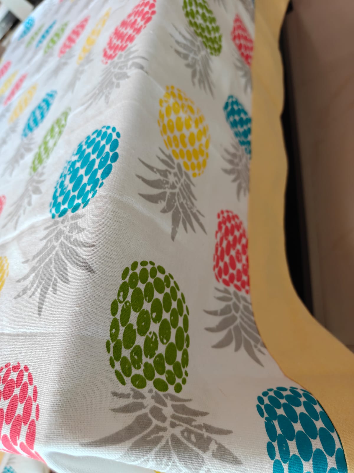 Colorful pineapple pattern on a fabric surface