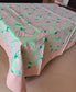 Tablecloth with pink and green pattern on a table