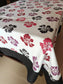 Floral patterned tablecloth on a table with a plain background
