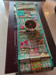 Decorative embroidered table runner on a wooden table