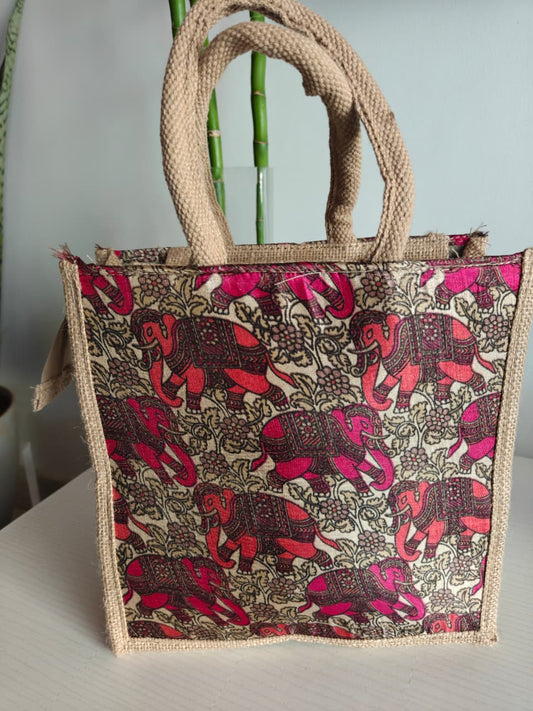 Tote bag with elephant pattern and jute handles on a neutral background