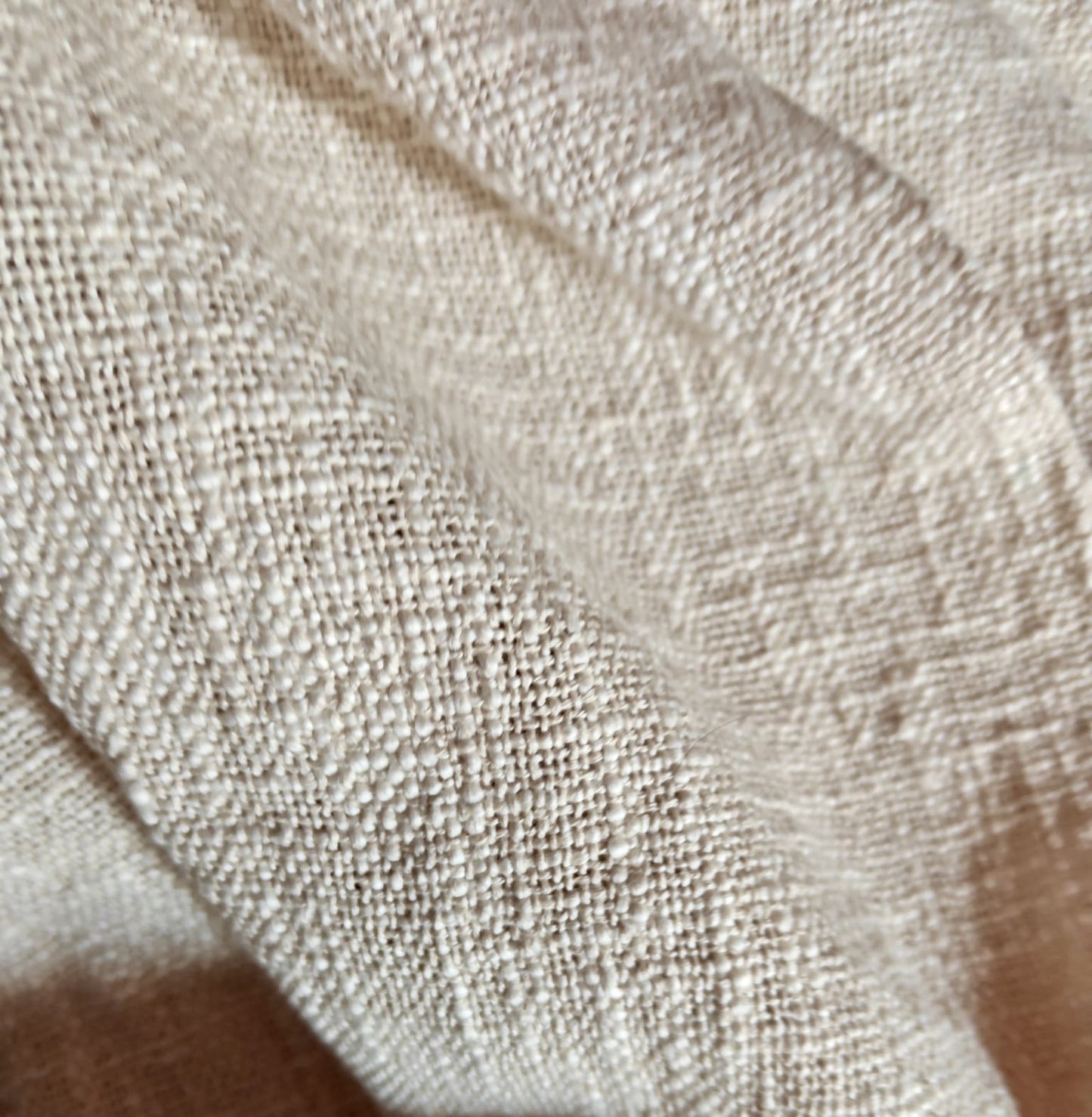 Close-up of beige fabric texture