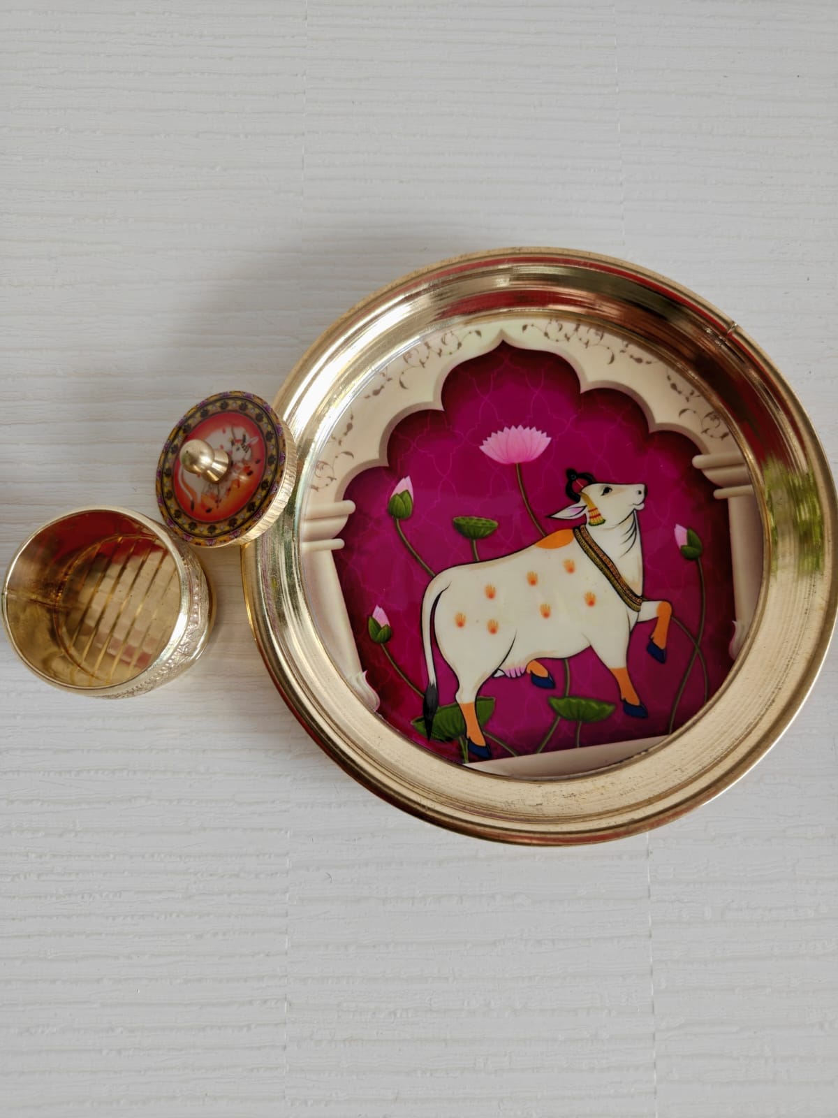 Buy Brass Pichwai Wine Cow  Kumkum Box with Plate ( 6 inches plate)